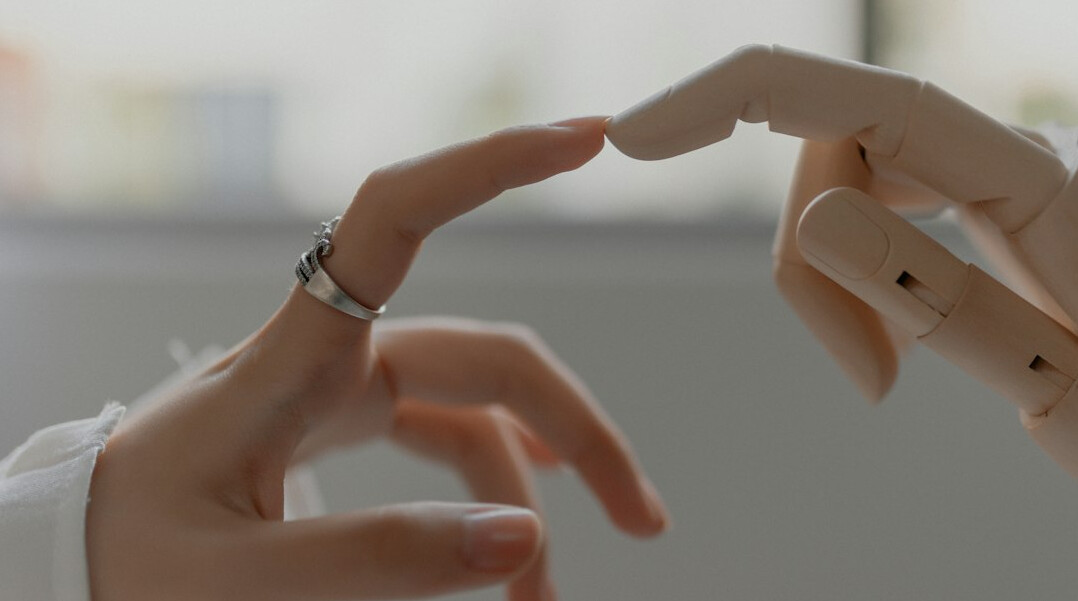 ai robot handshaking with human