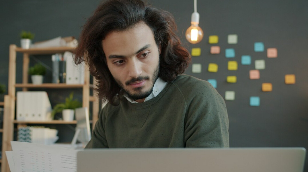 young entrepreneur using laptop with ai